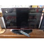 A Samsung 26'' LCD TV with remote and lead.