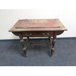 An Edwardian oak writing table,