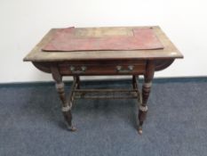 An Edwardian oak writing table,