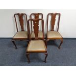 A set of four mahogany Queen Anne style dining chairs.