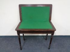 An Edwardian mahogany turnover top games table.