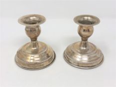 A pair of continental silver dwarf candlesticks, stamped 830, height 8cm.