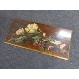 An early 20th century hand-painted oak panel depicting flowers