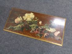 An early 20th century hand-painted oak panel depicting flowers