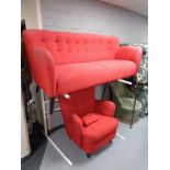 A settee and armchair in red buttoned fabric