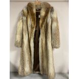 A lady's 3/4 length fox fur coat.