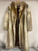 A lady's 3/4 length fox fur coat.