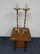 A walnut two tier occasional table together with a pair of brass smoker's stands.