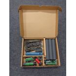 A box containing Hornby engines, tenders and coaches, together with a small quantity of track.