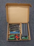 A box containing Hornby engines, tenders and coaches, together with a small quantity of track.