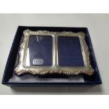 A boxed Sheffield silver twin photograph frame,
