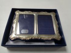 A boxed Sheffield silver twin photograph frame,