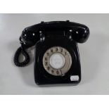 A black Bakelite cased telephone