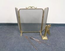A brass framed three-way folding spark guard together with a part brass companion set and further
