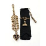 Two ornate gold plated decorations or watch hangers.