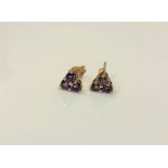 A pair of 9ct gold amethyst cluster earrings. CONDITION REPORT: 1.