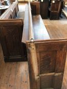 A two-section Gothic revival church pew, total length approximately 570 cm.