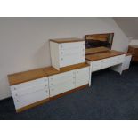 A 20th century white teak topped six piece bedroom suite comprising of four drawer dressing table,