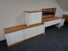 A 20th century white teak topped six piece bedroom suite comprising of four drawer dressing table,