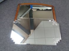 A shaped Art Deco frameless bevel edged mirror together with a further Edwardian oak framed bevel