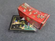 A Chinese style lacquered chest together with a low table, fitted a drawer.