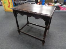 A nineteenth century carved oak occasional table