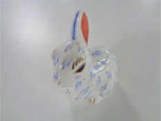 A Royal Crown Derby Snowy Rabbit paperweight with gold stopper.