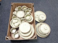 A box containing Denby tea and dinner ware.