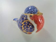 A Royal Crown Derby robin paperweight with silver stopper.