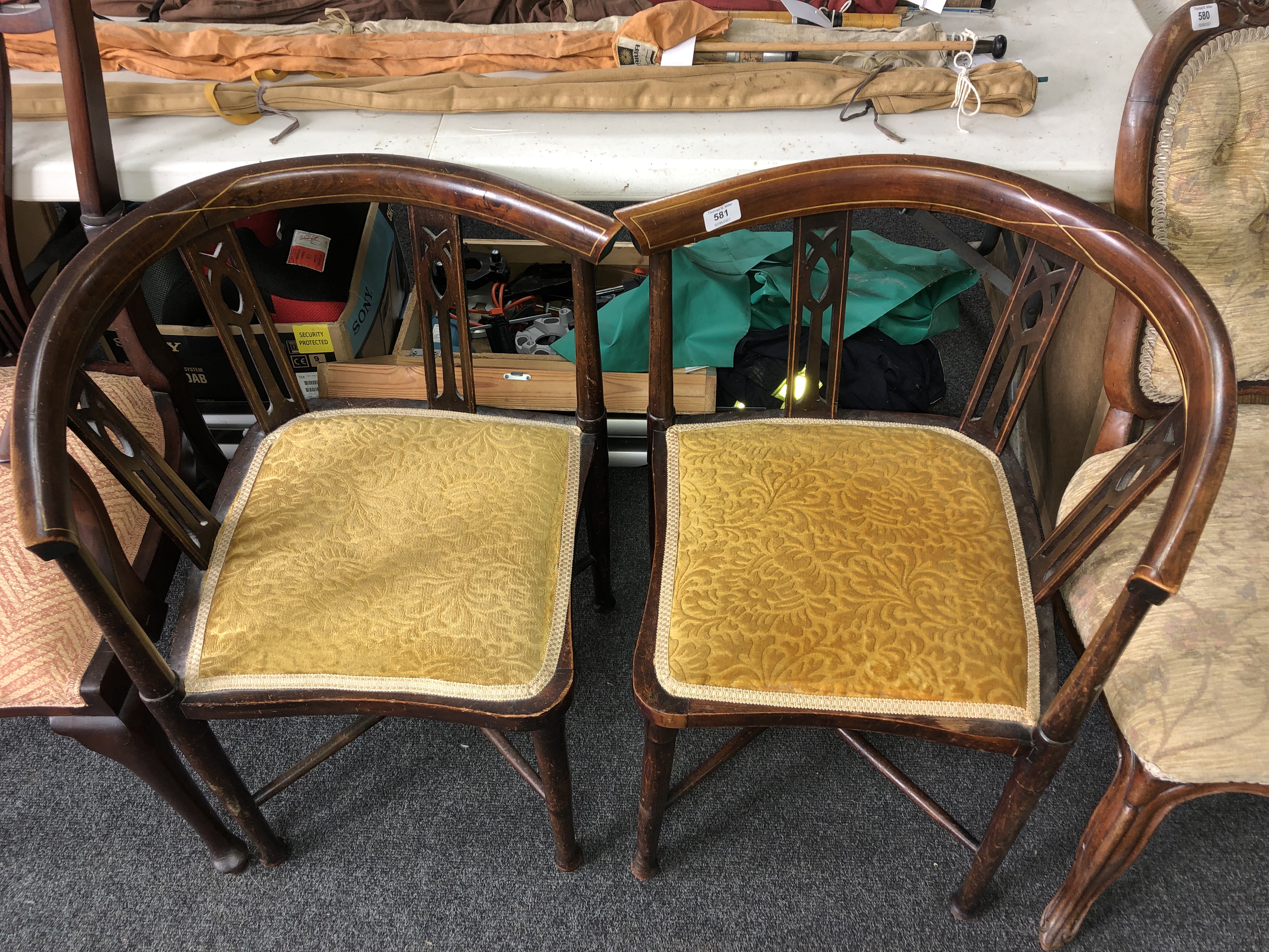 A pair of inlaid mahogany corner armchairs