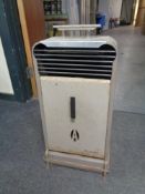 A 20th century Aladdinique paraffin heater.