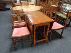 An oak barley twist gateleg table together with a set of four chairs