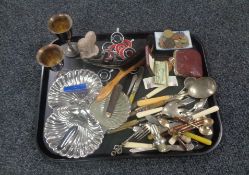 A tray containing miscellaneous to include foreign coinage, plated cutlery,