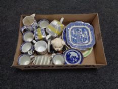 A box containing assorted Ringtons china to include novelty money boxes, teapots,