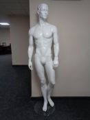 A male mannequin on stand (white gloss).