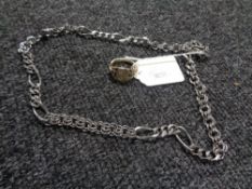 A heavy steel necklace chain together with gold plated Gentleman's ring.