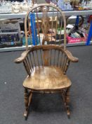 A beech Windsor rocking chair