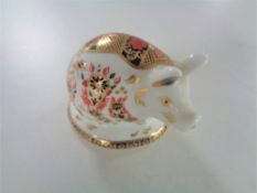 A Royal Crown Derby pig paperweight with silver stopper.