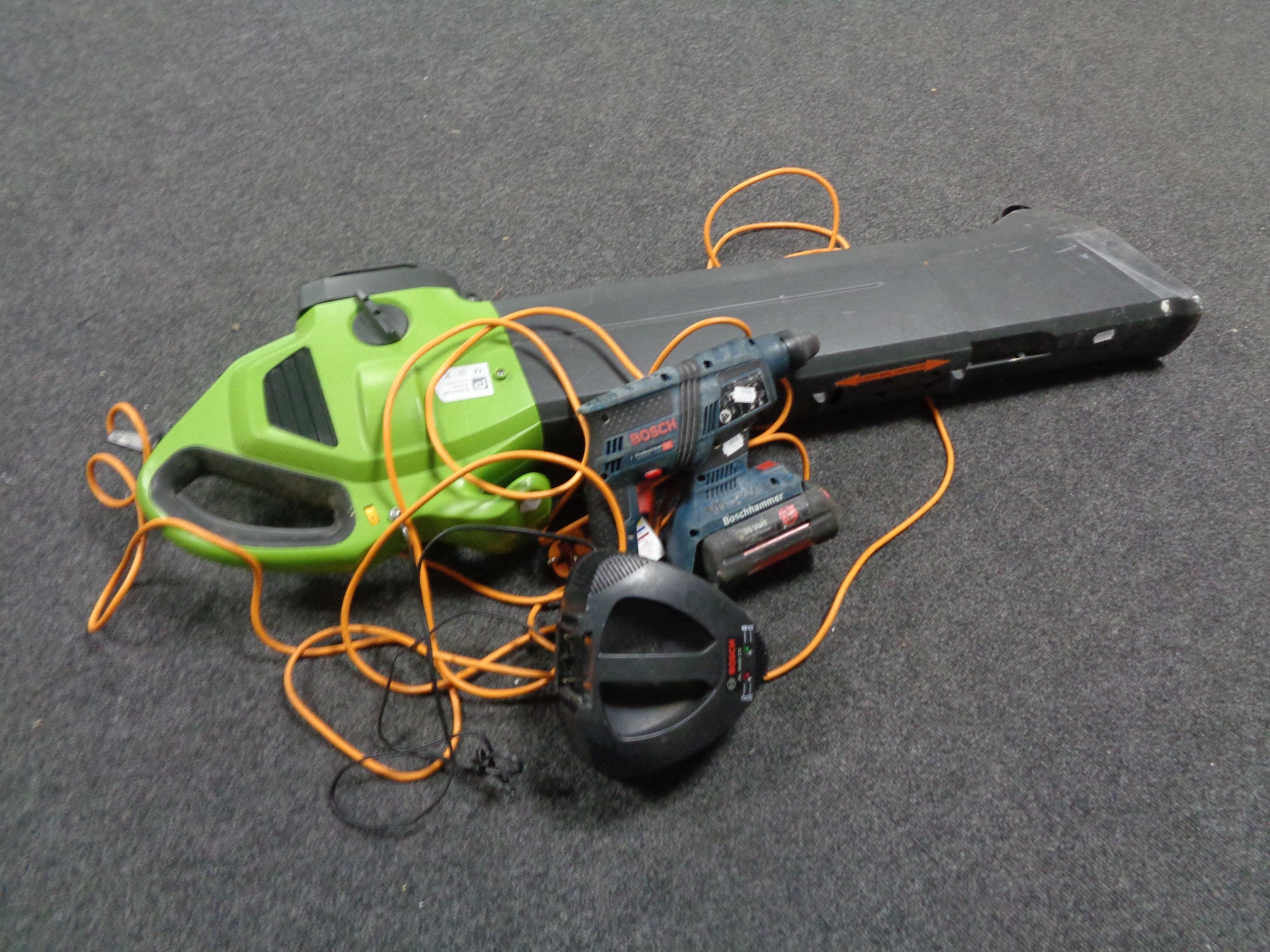 A Performance blower vacuum together with a Bosch 36 volt electric drill with battery and charger.