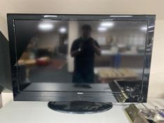 A Hitachi 50'' LCD TV with remote.