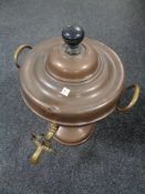 An antique brass and copper Samovar.