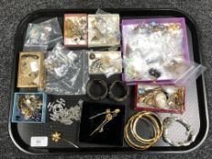 A tray containing a large quantity of assorted costume jewellery, musical compact,