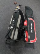 A child's Dunlop golf bag containing half set of clubs together with a further golf bag containing