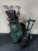 A golf bag containing Ram irons and Mercury drivers with folding trolley together with a child's