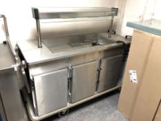 An Moffat commercial stainless steel food counter fitted with cupboards