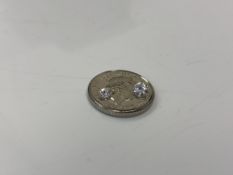 Two loose brilliant cut diamonds, 3.95mm diameter and 2.93mm diameter, total approx 0.25ct.