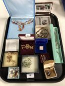 A tray containing a quantity of costume jewellery to include silver and dress rings, necklaces,