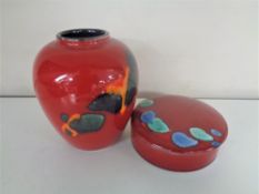 A Poole pottery Odyssey lidded powder bowl and vase.
