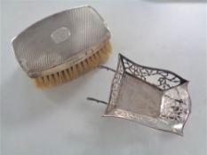 A miniature silver wheelbarrow, Birmingham marks, together with a silver backed brush.