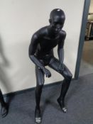 A male mannequin, no stand, seated (black).